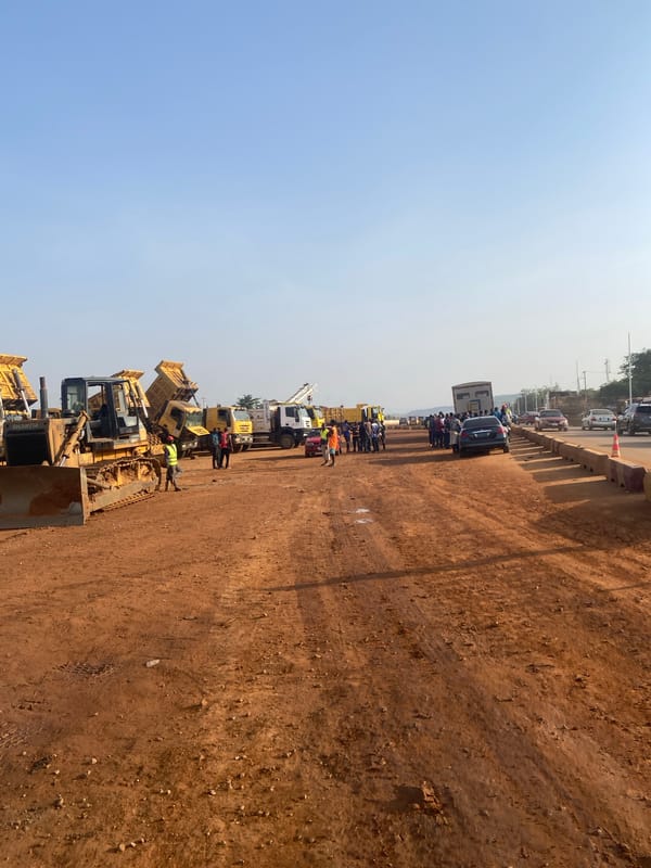 Road construction underway in Abuja with heavy machinery
