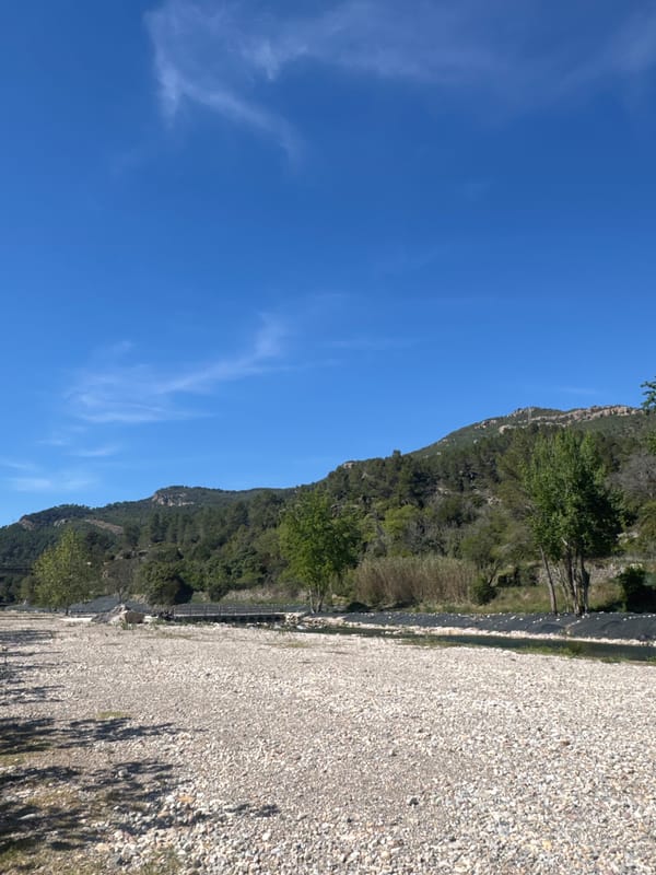 Forested hillside and gravel area observed in Montanejos, Spain