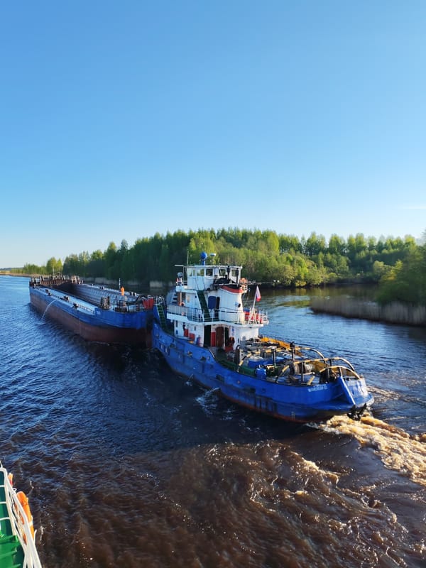 Russian tugboat pushes barge 7665 through Ozernoe Ust'e waterway