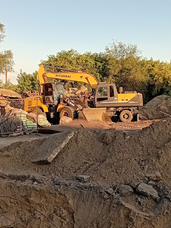 Active construction and renovation across a Semey urban work site