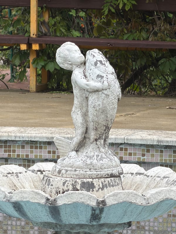 Stone cherub statue with fish spotted in Pazardzhik
