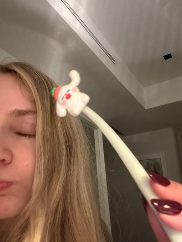 Late-night reader enjoys book with novelty rabbit pen in Mexico City