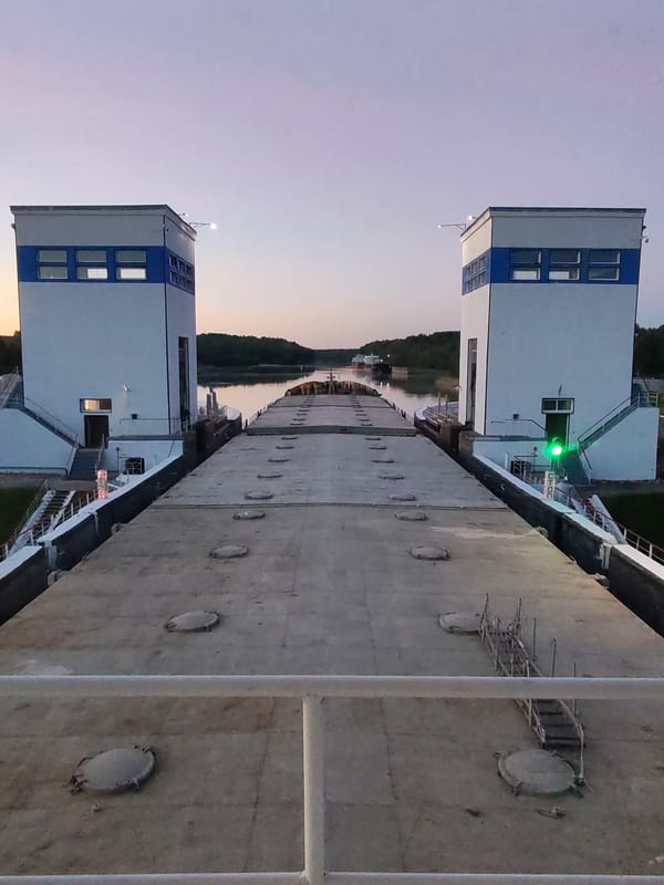 Vessel transits canal lock system during twilight operations