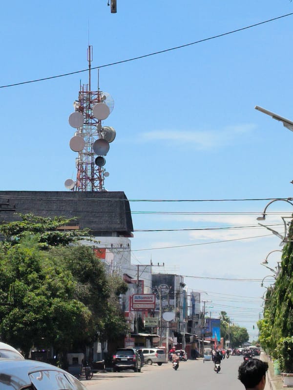 Telecommunications tower observed in Lhokseumawe street scene