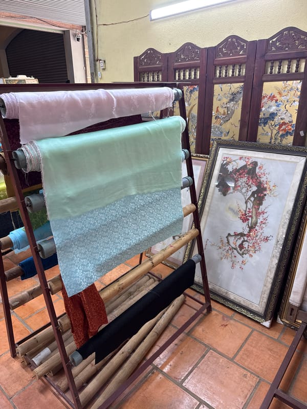 Textile workshop with traditional Vietnamese displays documented in Nam Ban