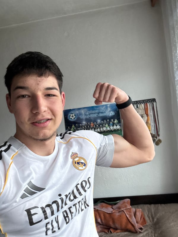 Young man takes selfies flexing in Real Madrid jersey
