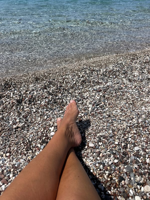 Morning beach scenes captured at Budva's pebble shore