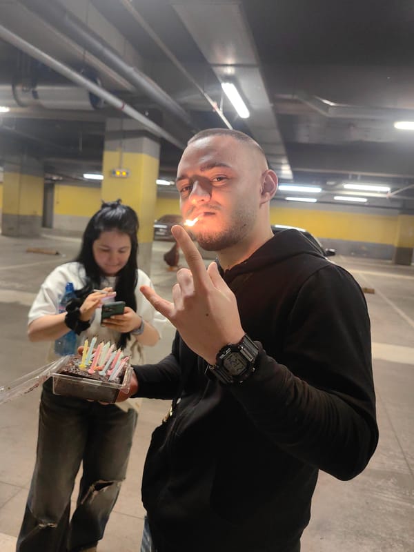 Man smoking in underground parking garage, Sofia