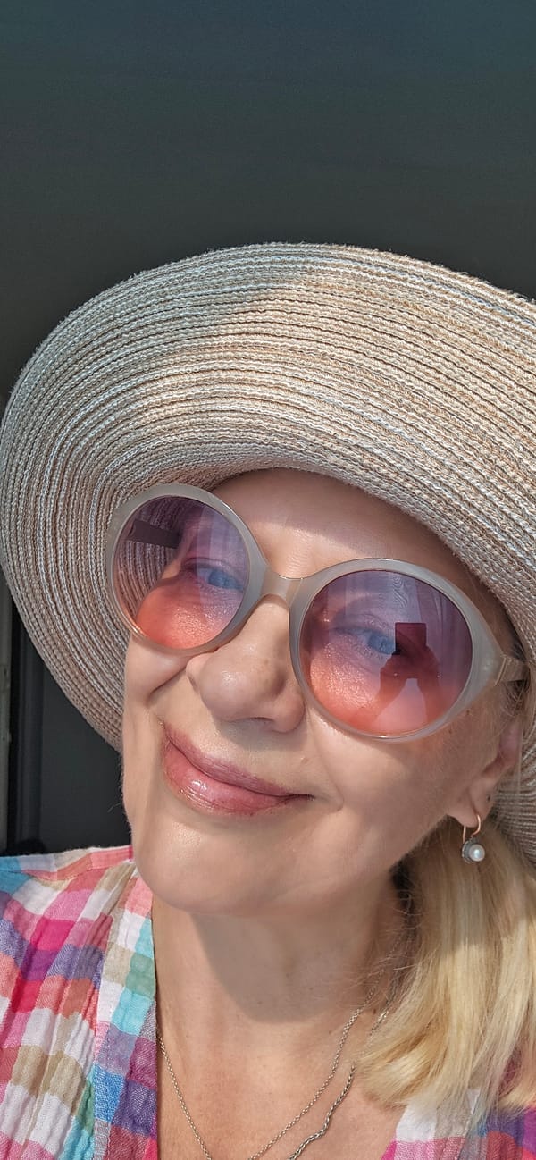 Straw hat and sunglasses selfie paired with eyewear promo graphic