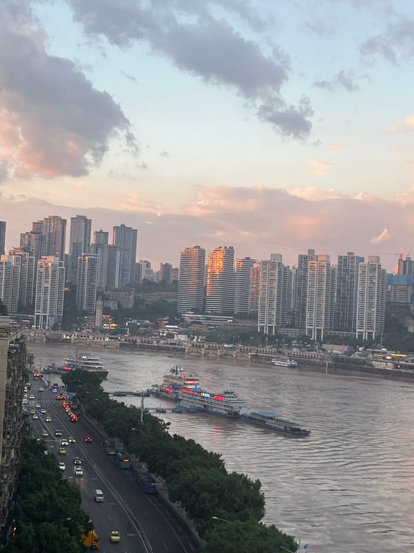 Chongqing's riverfront bridges and skyline at golden hour