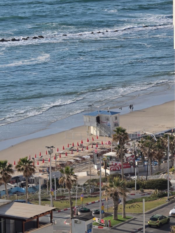 Aerial views document Bat Yam beach and construction activity