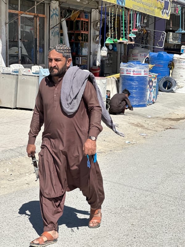 Street scenes captured in Quetta with man, bus workers