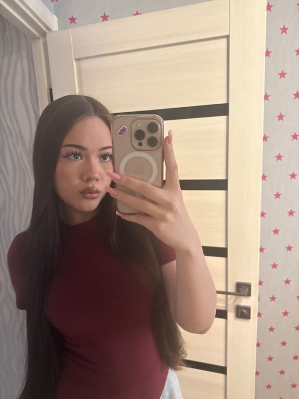 Woman takes multiple selfies in bedroom, Naberezhnye Chelny, Russia