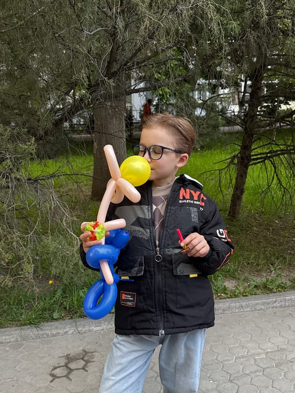 Boy in glasses observed on sidewalk, additional media unprocessed