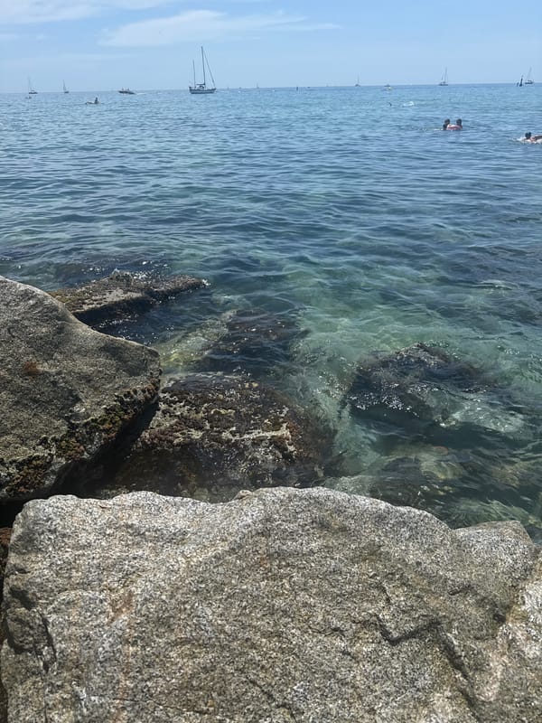 Summer beach day in Badalona with coastal dining and water activities