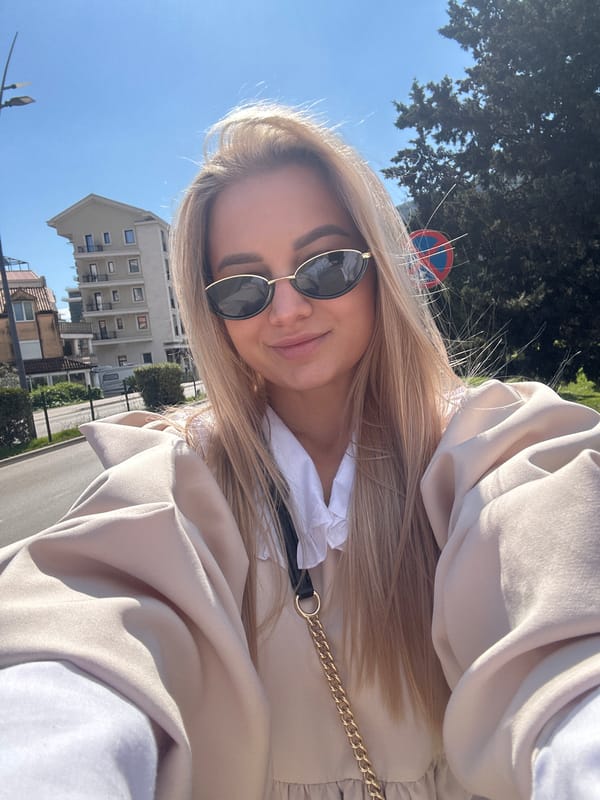 Woman enjoys spring afternoon among daisies in Budva