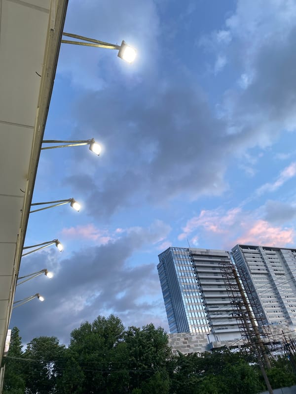 Modern skyline and street infrastructure in Gambut Barat at dusk