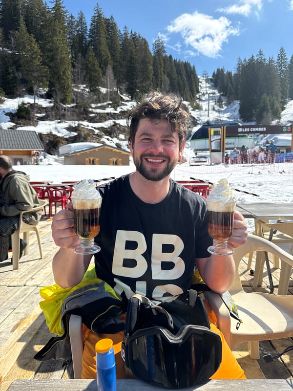 Man enjoys layered drinks in Châtel, France