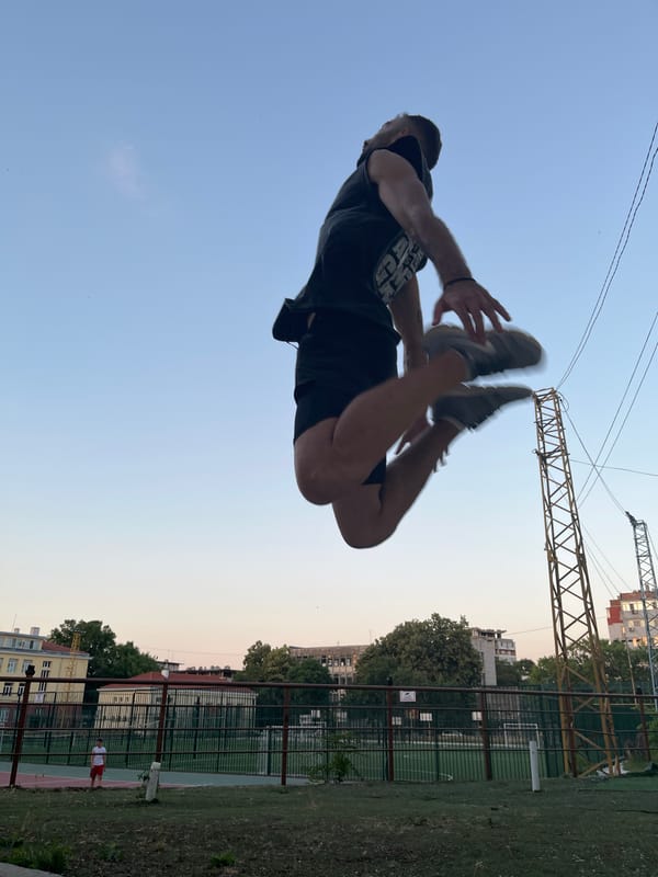 Acrobatics and parkour on a Shumen outdoor court