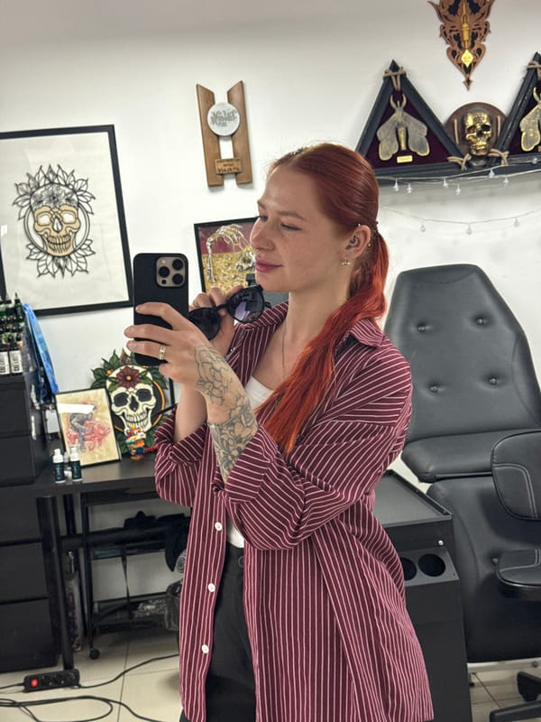 Woman documents tattoo session with selfies in Rostov-on-Don studio