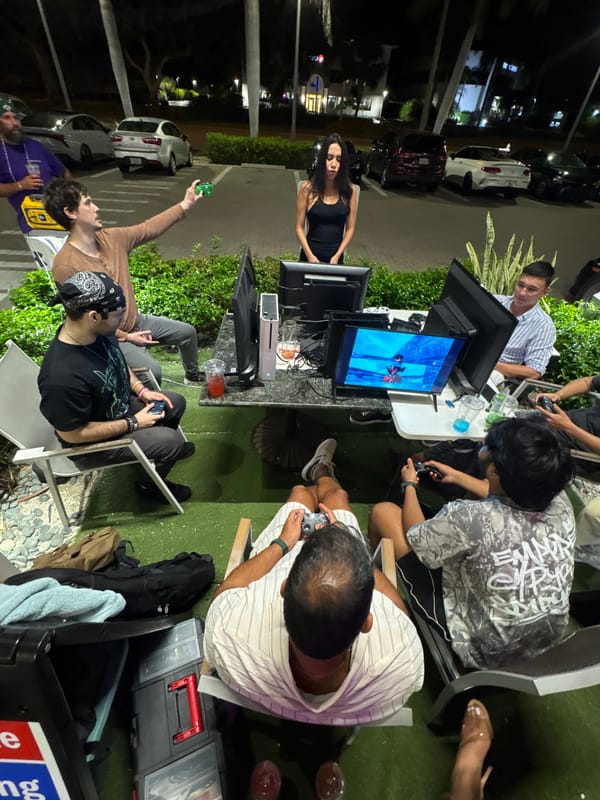 Nighttime outdoor gaming session draws young adults to screens