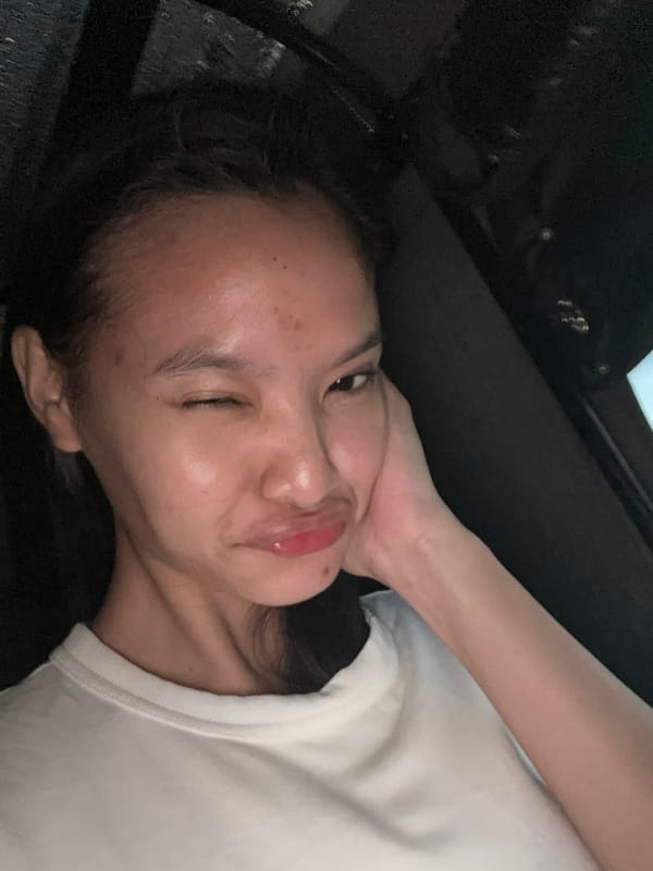Woman takes selfies during evening drive through Davao City