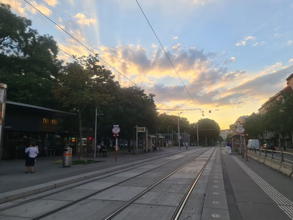 Vienna tram corridor at golden hour, inside and out
