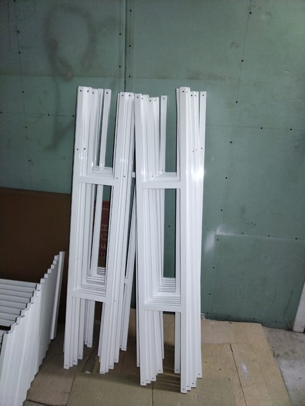 Window frames and labeled end caps in a Pargolovo construction storage area