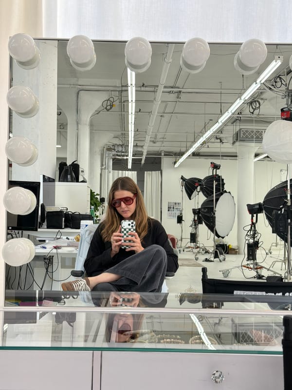 Person documents selfies in Los Angeles photography studio