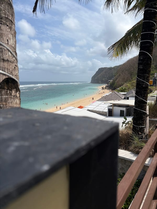 Poolside and shoreline at a Kuta Selatan beach resort