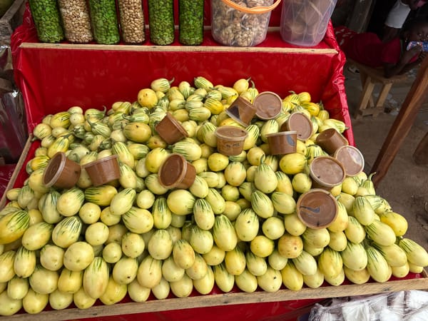 Lafia market stalls loaded with eggplants, watermelons, and dates