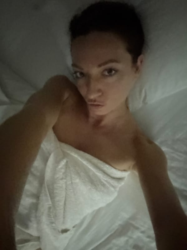 Self-portrait taken on bed in Bản Đêu, Vietnam