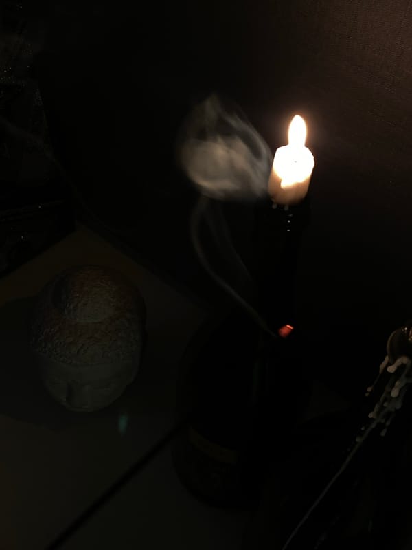 Woman takes mirror selfies in dimly lit Votkinsk room