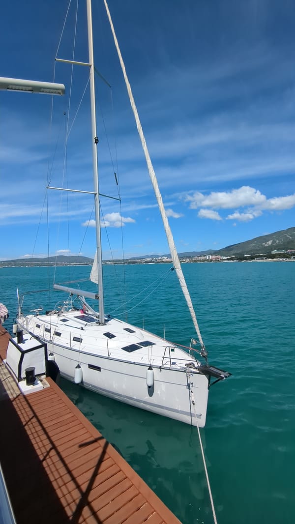 White sailboat spotted at Gelendzhik marina on sunny morning