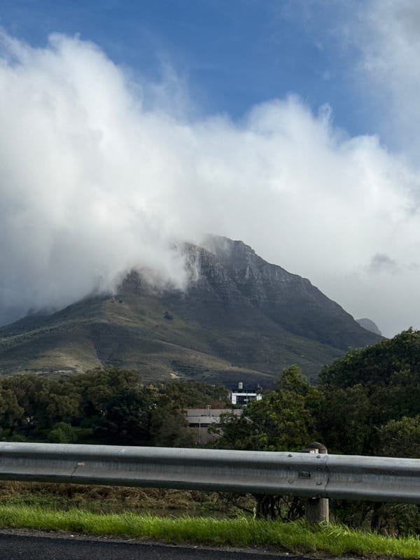 Table Mountain partially clouded over in Cape Town afternoon