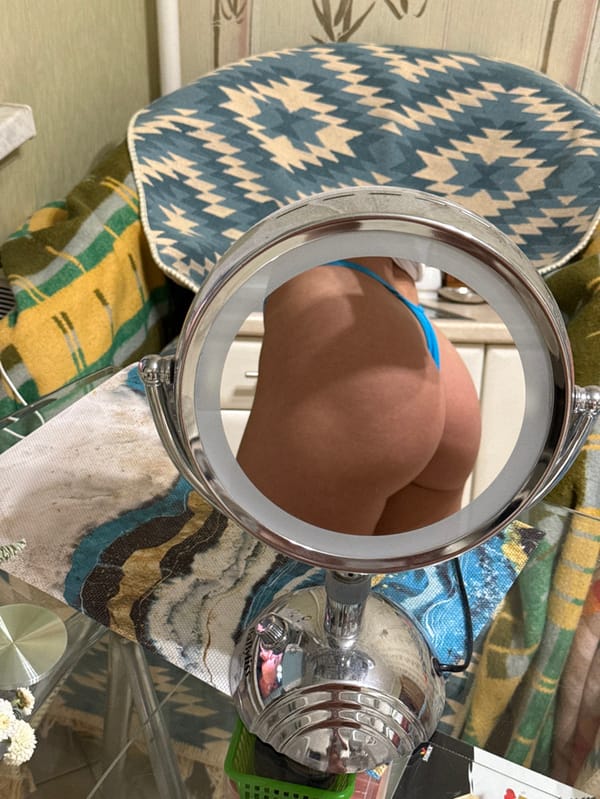 Woman takes repeated mirror selfies in Saint Petersburg bathroom