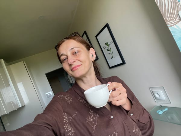Mirror selfies and a morning cup with a city view