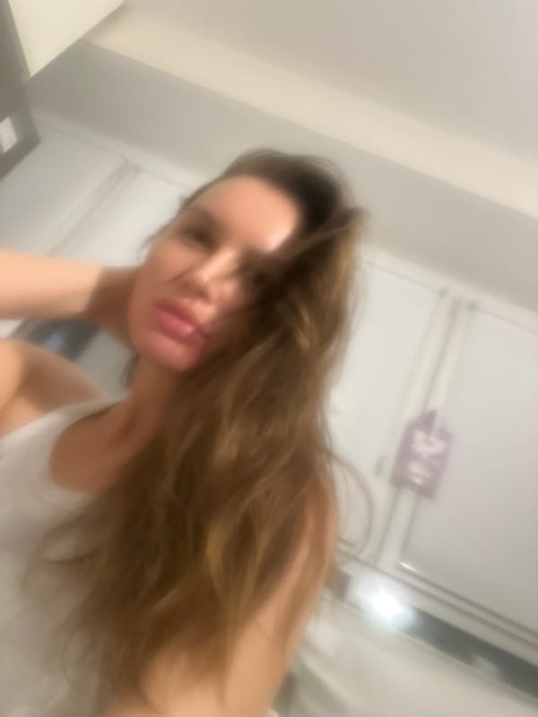 Woman takes evening selfies in Moscow apartment