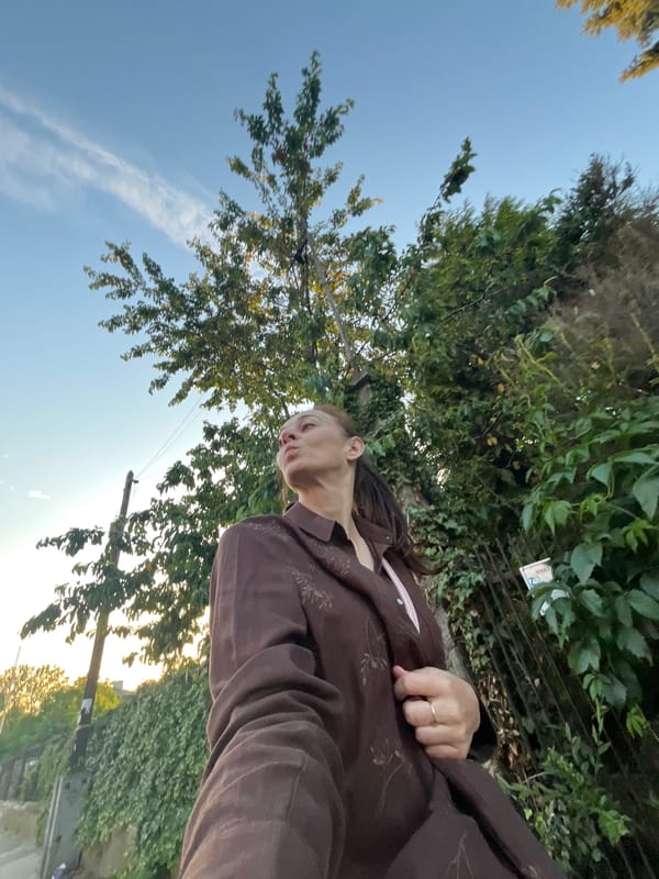 Selfie session on a city street at golden hour