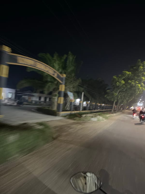Nighttime ride through Bundar's streets, mosques, and food stalls