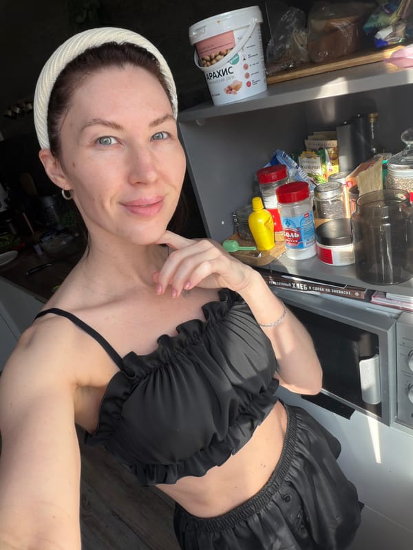 Woman takes early morning kitchen selfie in Perm