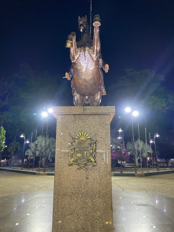 Nighttime scenes documented in Tinaquillo, Venezuela show statue and streetlights