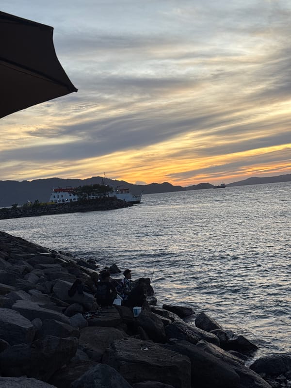Sunset and ferry traffic at Ulee Lheue Beach, Banda Aceh