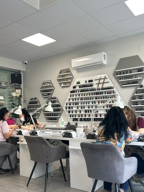 Morning business activity observed at nail salon and cafe