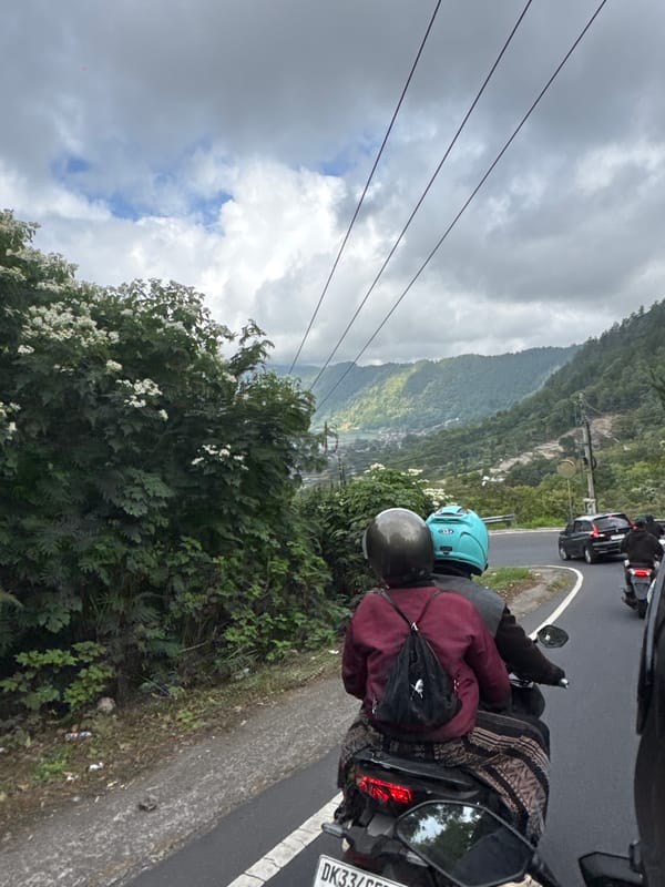 Motorbike run through Kintamani with Mount Batur in the clouds