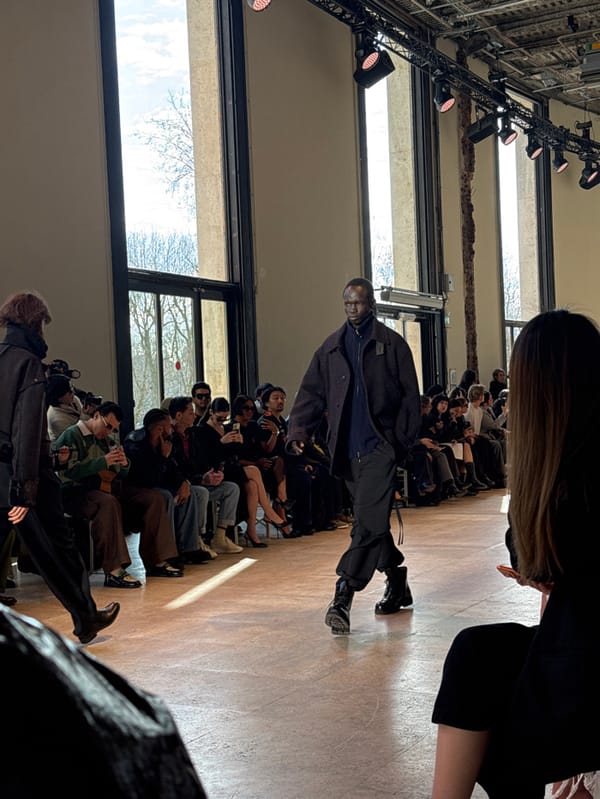 Fashion show features runway models, audience recordings at unknown venue