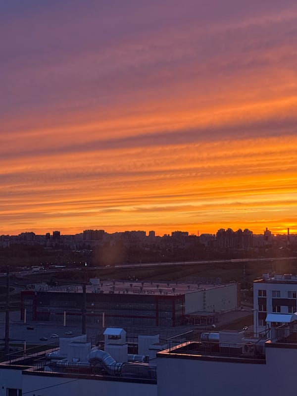Sunset creates colorful sky over city skyline May 6