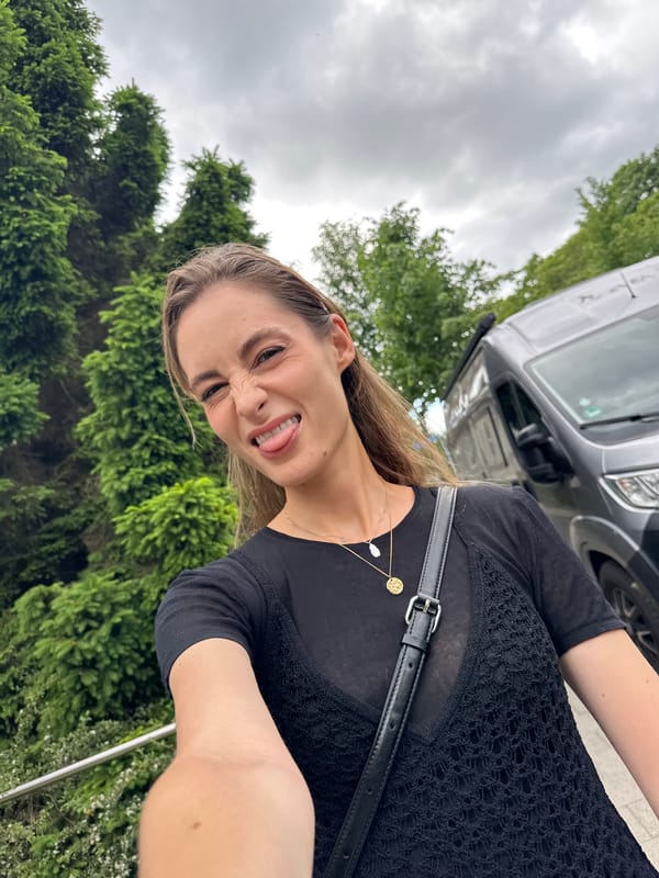 Woman poses for photos on Kiel sidewalk