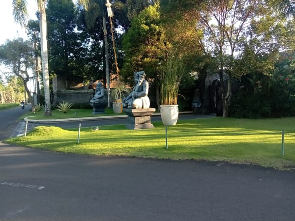 Ornate stone statues and tropical gardens in Blahbatuh, Bali
