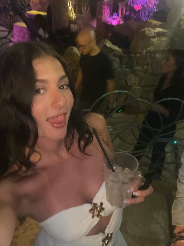 Woman takes playful selfie with tongue out